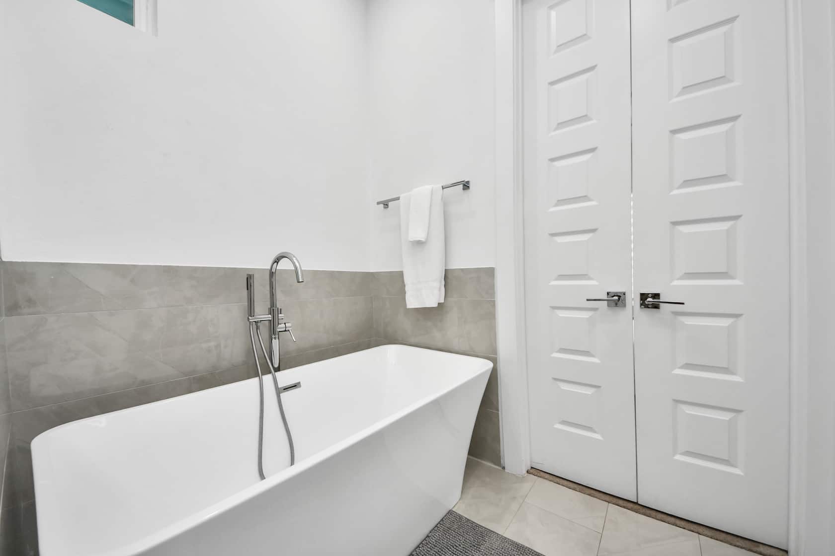 Bathroom with a freestanding soaking tub and glass walk-in shower